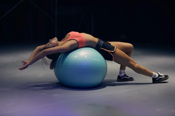 Female working out using exercise ball